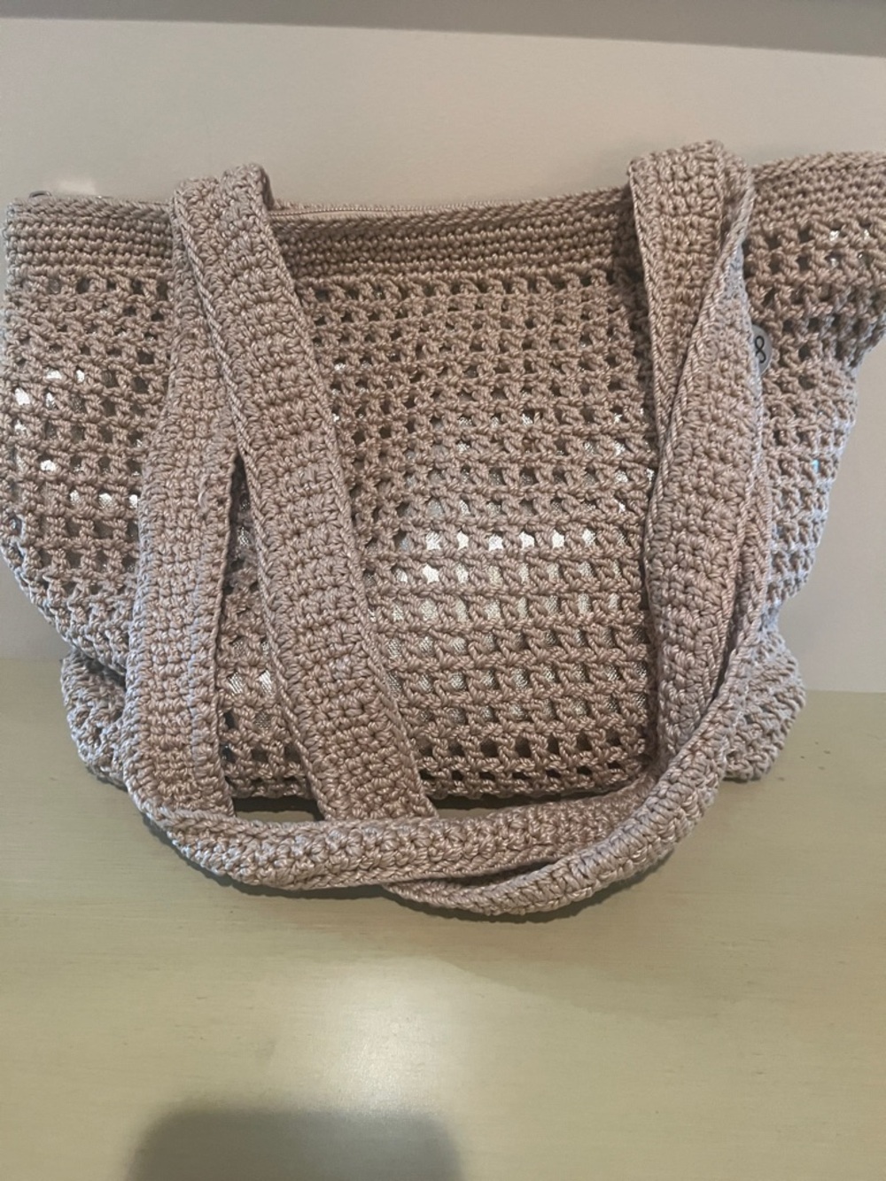 The Sak Crocheted Tote Bag in Taupe or Shoulder Bag with Metallic Underlining